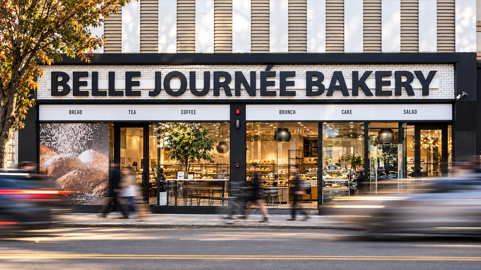 Belle Journée Bakery storefront with its sign in focus and passing street traffic in motion.